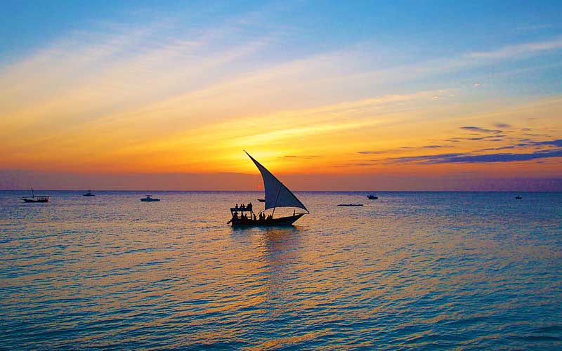 Dhow-boat-sailing-sunset-Zanzibar